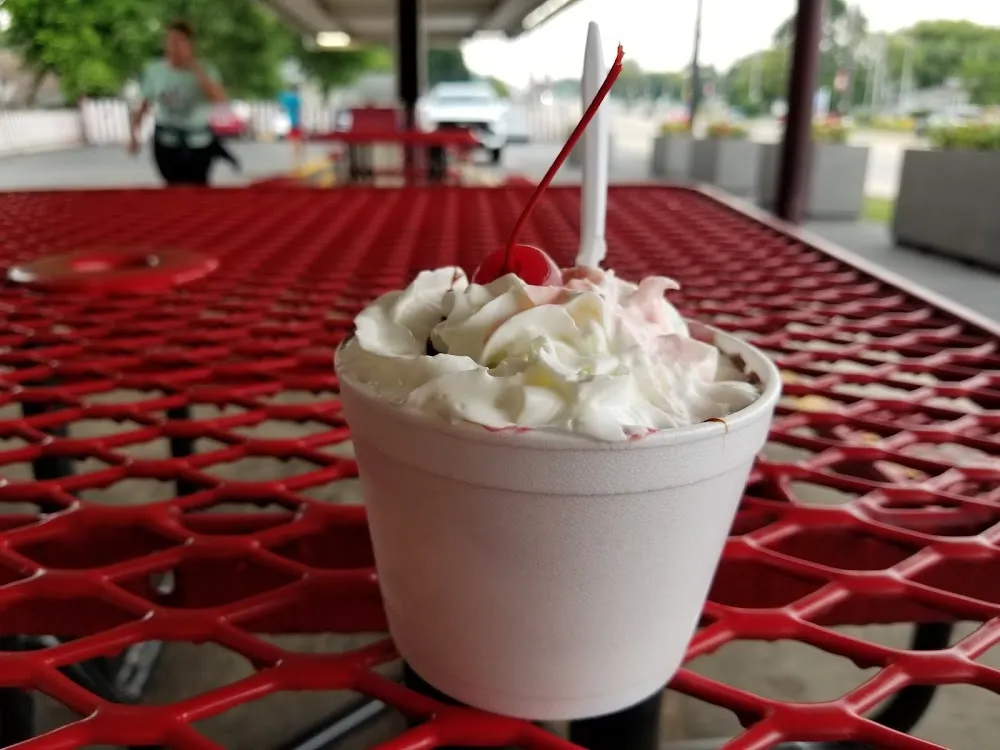 Medium Hot Fudge Sundae with Added Raspberry Sauce Whipped Cream and a Cherry